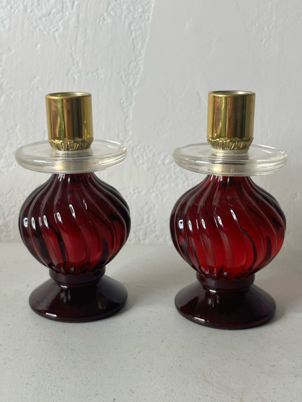 Avon Pair of Red Swirl Glass candlestick holders Gold Caps
